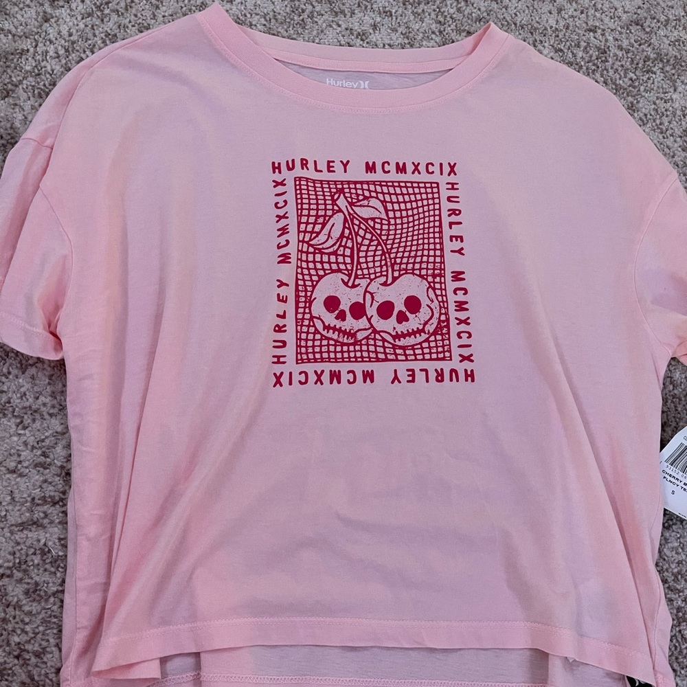 Pink Hurley Shirt with red lettering on it